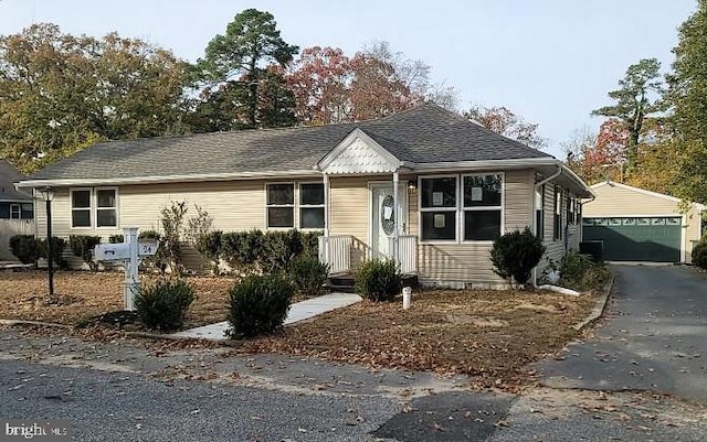 view of front of property with an outbuilding and a garage