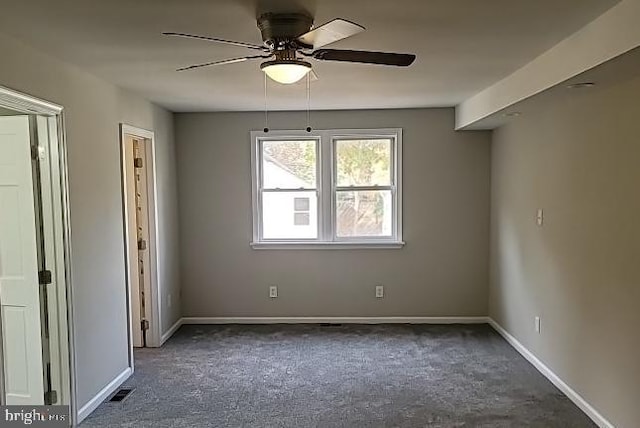 carpeted empty room featuring ceiling fan