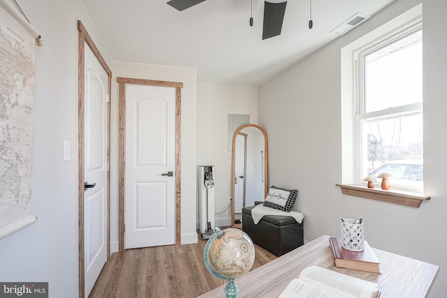 interior space featuring hardwood / wood-style flooring and ceiling fan