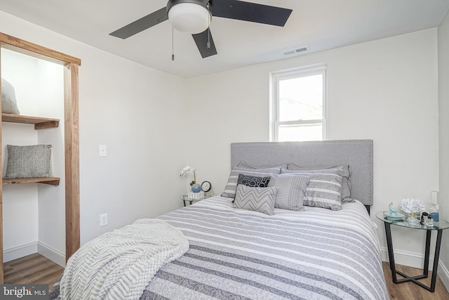 bedroom featuring hardwood / wood-style flooring and ceiling fan