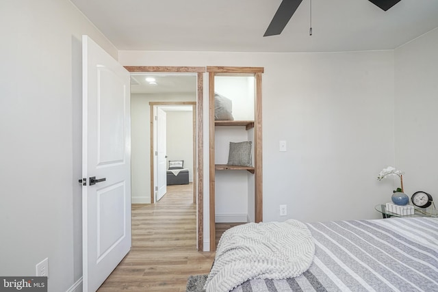 bedroom featuring a closet, light hardwood / wood-style flooring, and ceiling fan