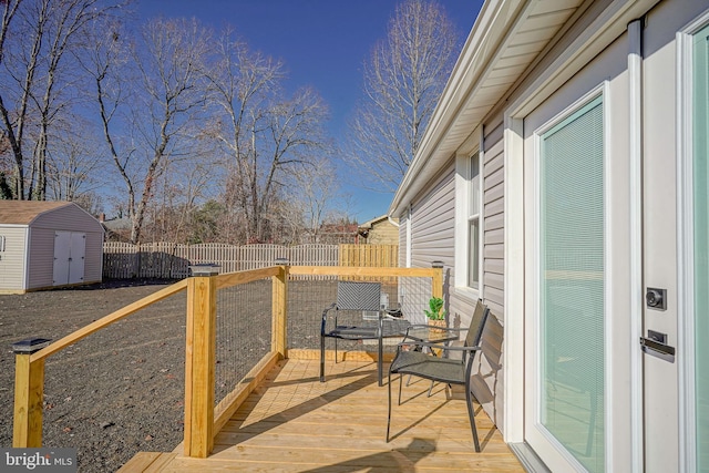 wooden terrace with a storage unit