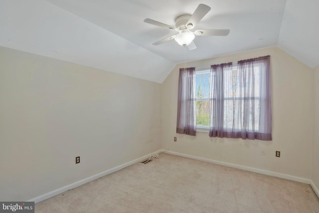 bonus room with ceiling fan, light colored carpet, and lofted ceiling