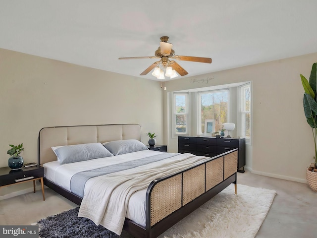 bedroom with ceiling fan and light colored carpet