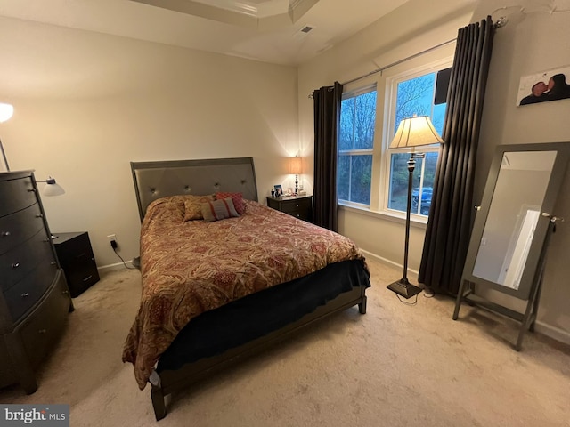 bedroom featuring light colored carpet