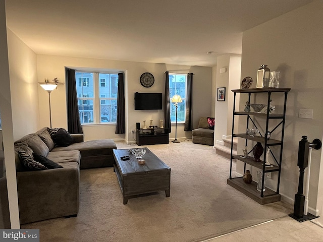 living room featuring carpet floors and a wealth of natural light