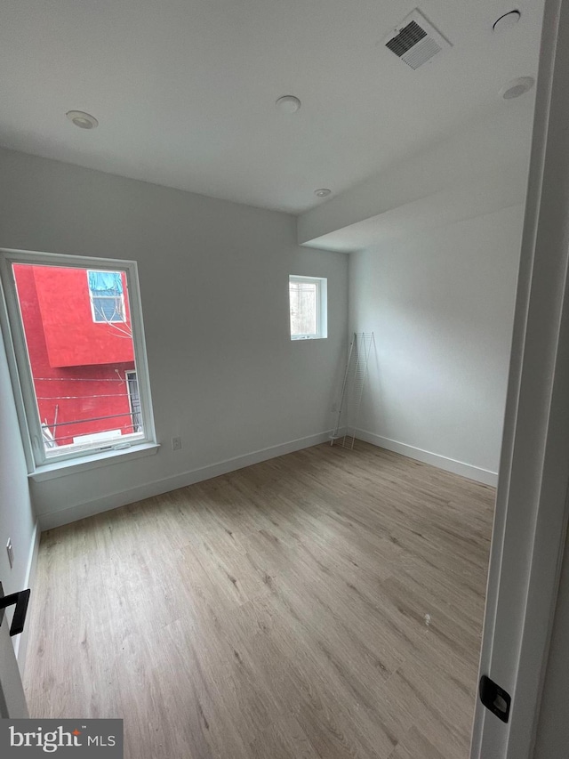 empty room with light wood-type flooring