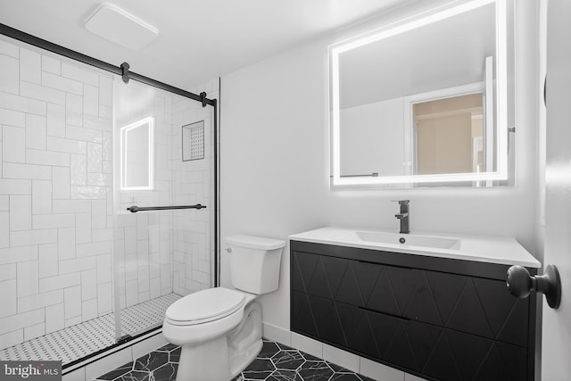 bathroom with tile patterned flooring, vanity, toilet, and an enclosed shower