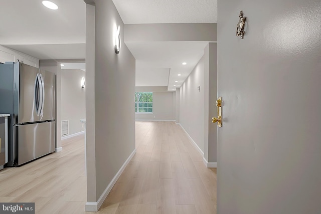 hallway featuring light wood-type flooring