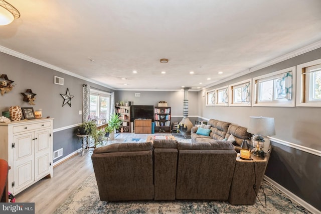 living room with crown molding and light wood-type flooring