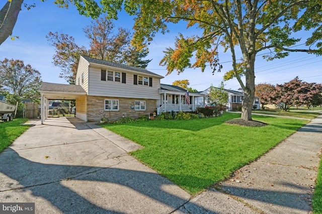 tri-level home with a carport and a front yard