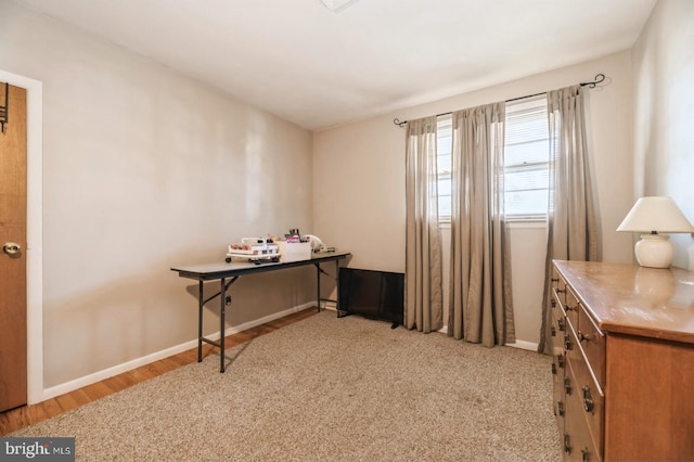 office with light hardwood / wood-style flooring