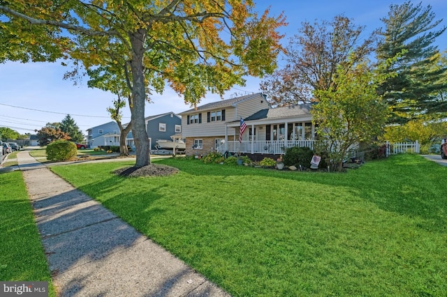 exterior space with a front yard and a porch