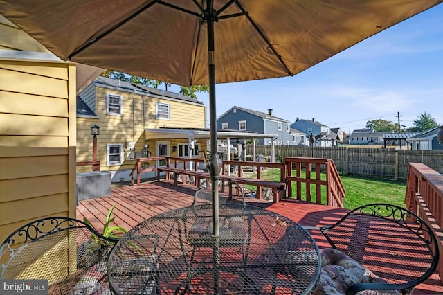 wooden deck with a yard