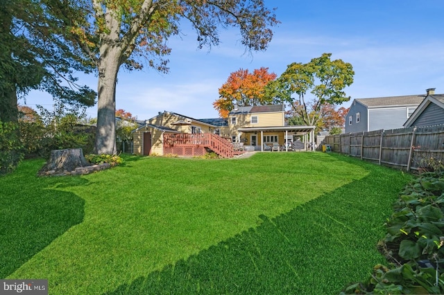 view of yard featuring a wooden deck