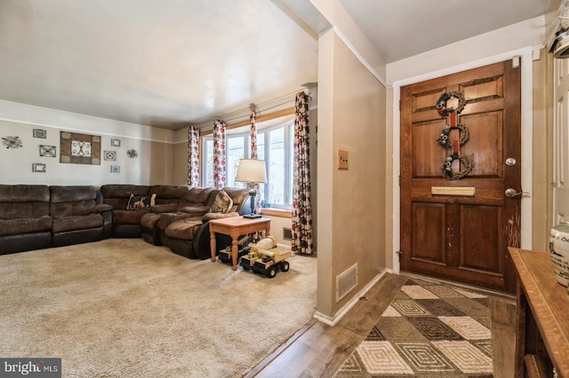 entryway with dark hardwood / wood-style flooring