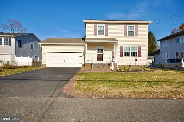 view of front of house with a front lawn and a garage