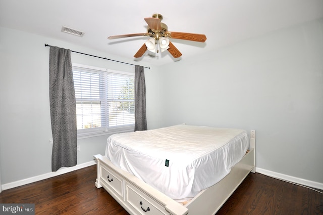 bedroom featuring ceiling fan and dark wood-type flooring