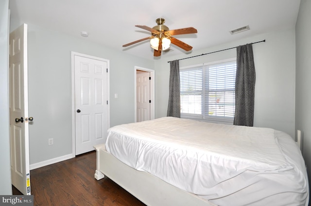 bedroom with ceiling fan and dark hardwood / wood-style flooring