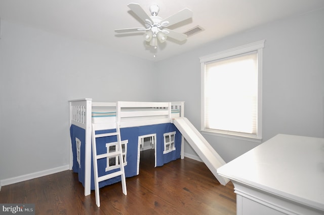 bedroom featuring ceiling fan and dark hardwood / wood-style floors