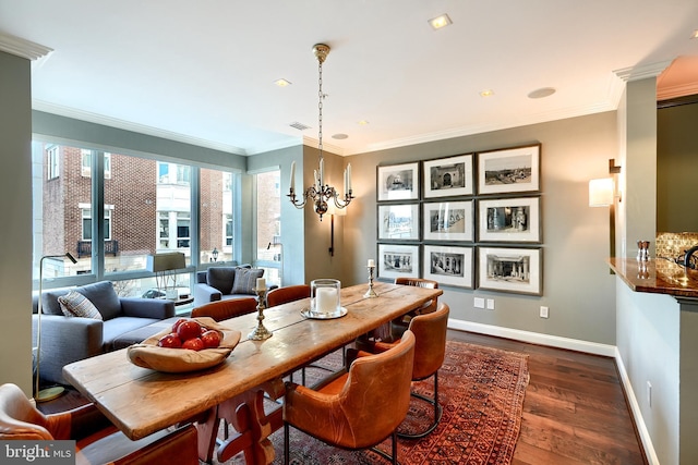 dining space with ornamental molding, dark hardwood / wood-style floors, and a chandelier