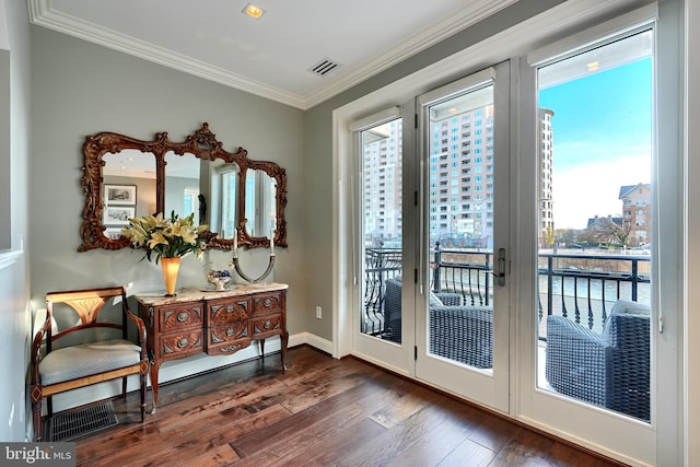 doorway with dark wood-type flooring and ornamental molding