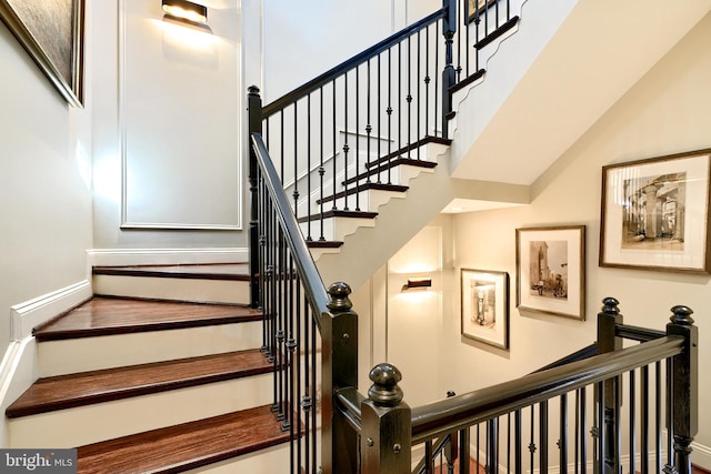 stairway with a towering ceiling