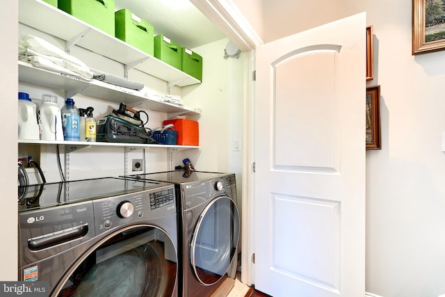 clothes washing area with washer and dryer