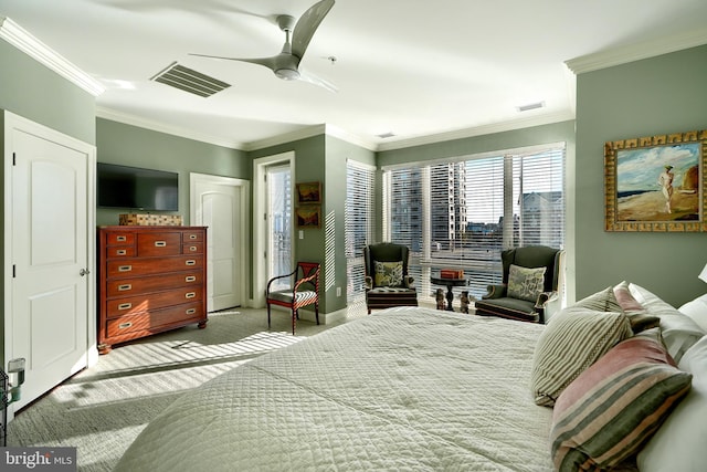 bedroom featuring light carpet, ornamental molding, and ceiling fan