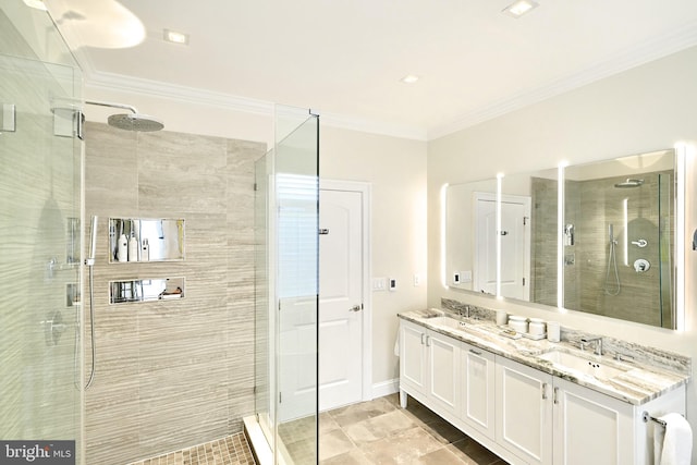 bathroom featuring vanity, crown molding, and a shower with shower door