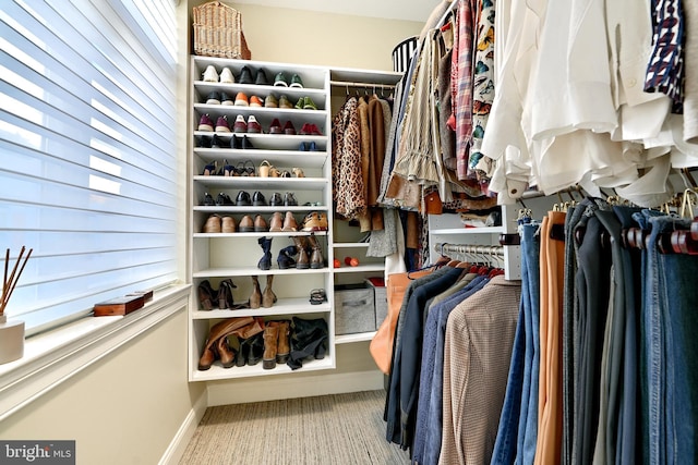 spacious closet featuring light hardwood / wood-style floors