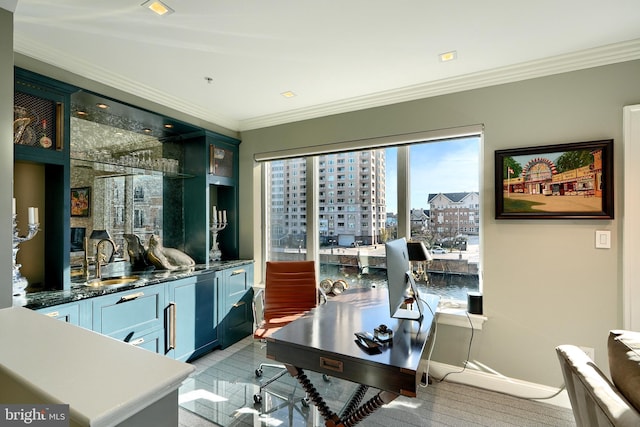 home office featuring crown molding, wet bar, and light wood-type flooring