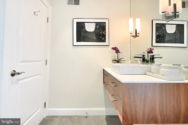 bathroom with tile patterned flooring and vanity