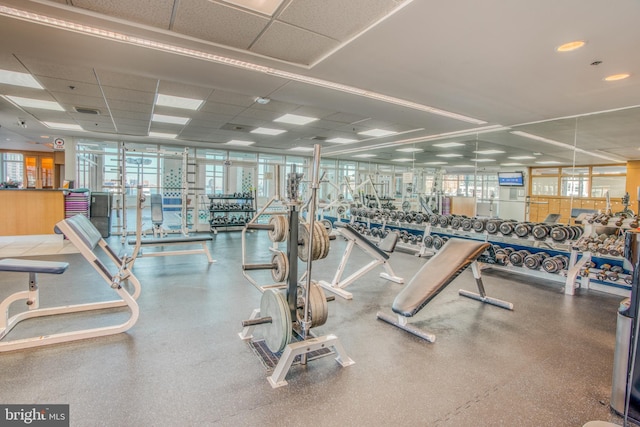 exercise room with a paneled ceiling