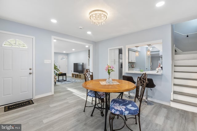 dining area with stairs, recessed lighting, and light wood-style floors