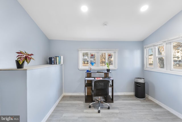 office area featuring vaulted ceiling, recessed lighting, wood finished floors, and baseboards