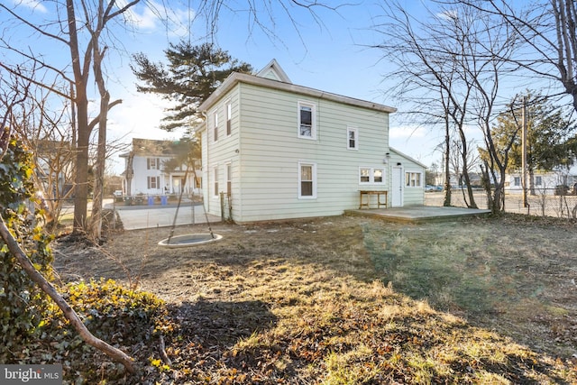 back of house with a patio area and fence