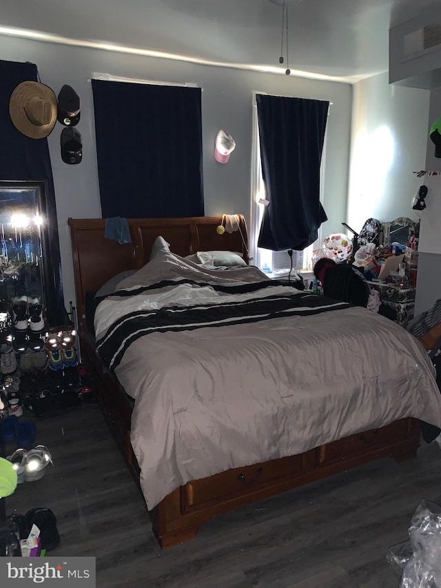 bedroom featuring dark wood-type flooring
