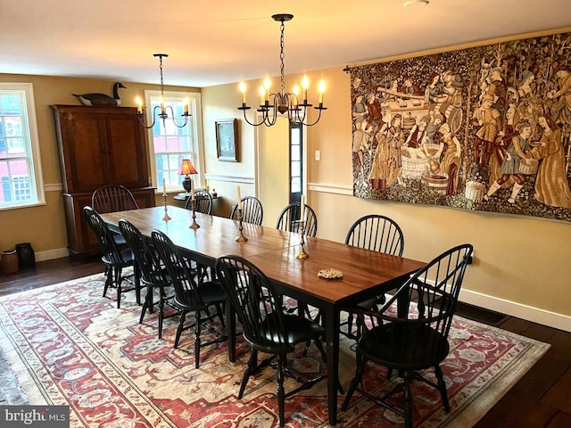 dining space featuring a chandelier, dark hardwood / wood-style floors, and plenty of natural light