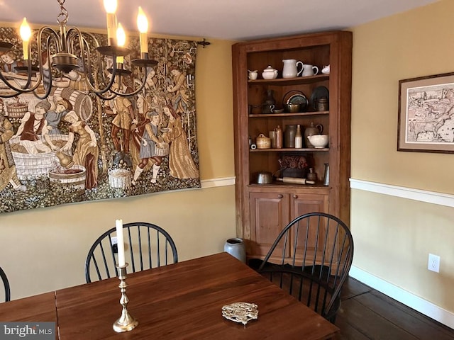 dining area featuring a chandelier and hardwood / wood-style flooring