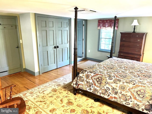 bedroom featuring a closet and wood-type flooring