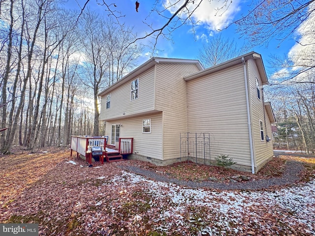 back of property featuring a deck