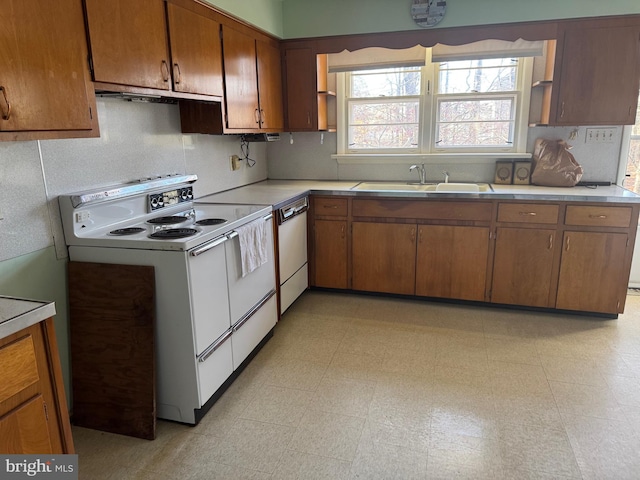 kitchen with sink and white appliances