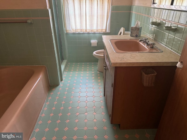 full bathroom featuring vanity, separate shower and tub, toilet, and tile walls