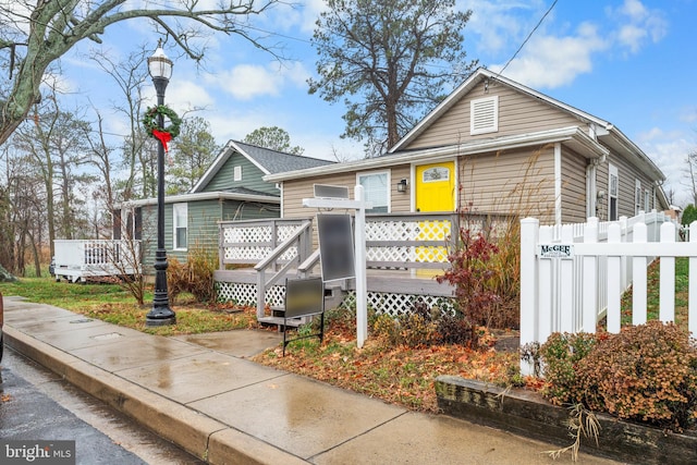 bungalow featuring a deck