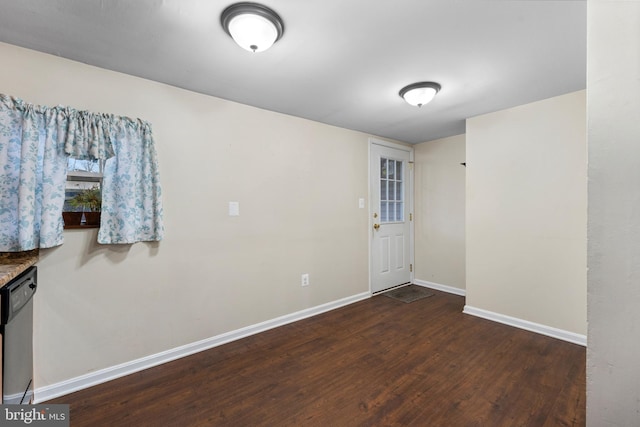 spare room featuring dark wood-type flooring