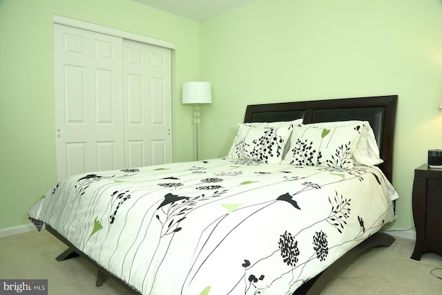 carpeted bedroom featuring a closet