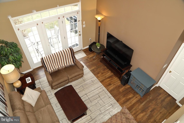 living room with french doors and dark hardwood / wood-style floors