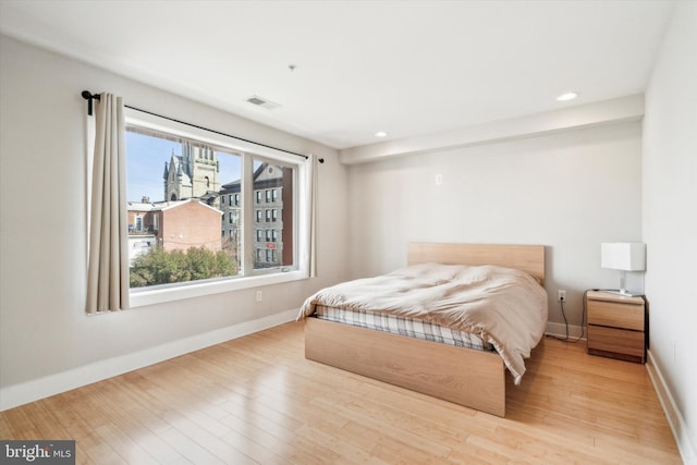 bedroom with light wood-type flooring