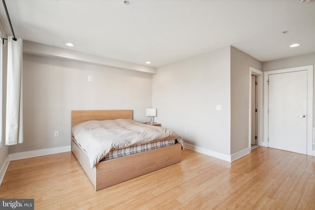 bedroom with light hardwood / wood-style floors